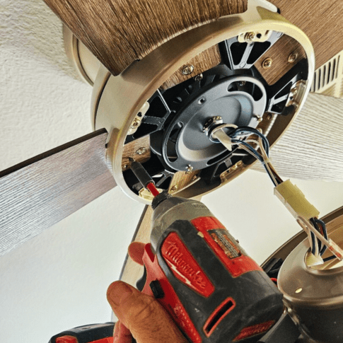 Opening up a ceiling fan to check electrical issues